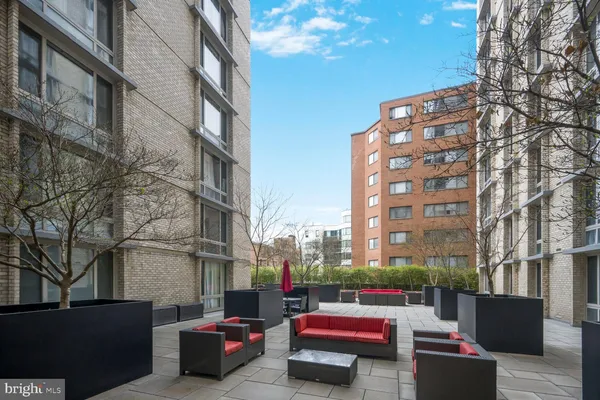 a view of a swimming pool and lounge chairs