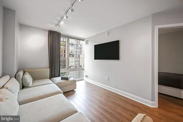 a bedroom with a bed and flat screen tv
