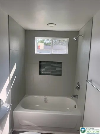 a bathroom with a sink a toilet and a bathtub