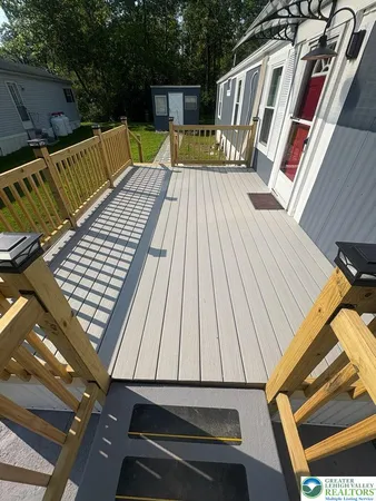 a view of roof deck with patio
