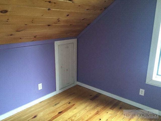 275 Parker Road Creston, NC 28615 - Photo 21 of 31 a view of a room with a fireplace