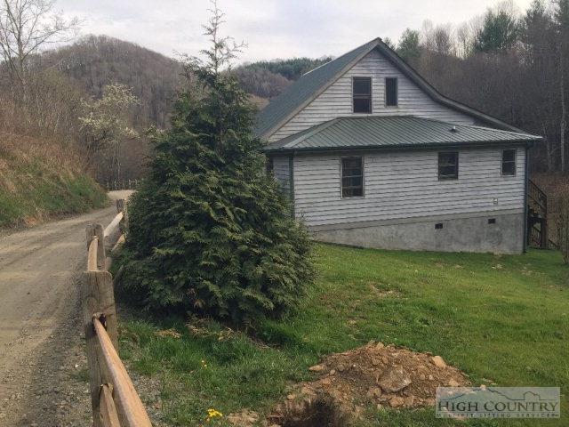 275 Parker Road Creston, NC 28615 - Photo 23 of 31 a house view with a backyard space