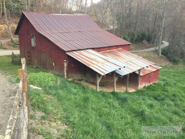 275 Parker Road Creston, NC 28615 - Photo 24 of 31 a backyard of a house with lots of green space