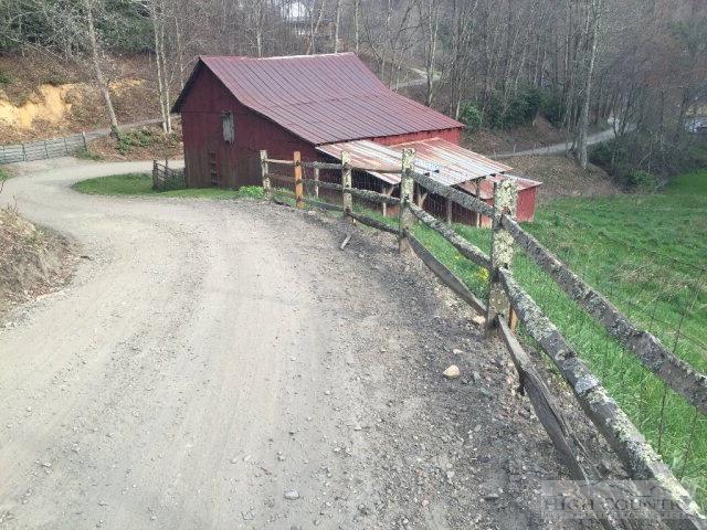 275 Parker Road Creston, NC 28615 - Photo 27 of 31 a view of a house with a yard