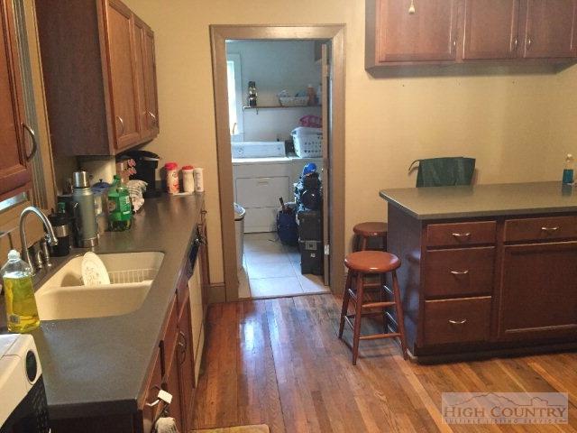 275 Parker Road Creston, NC 28615 - Photo 6 of 31 a room with a chair and wooden floor