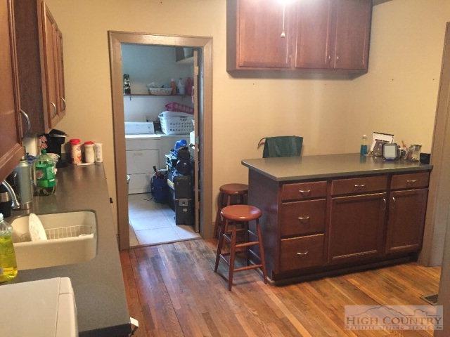 275 Parker Road Creston, NC 28615 - Photo 7 of 31 a room with a chair and wooden floor
