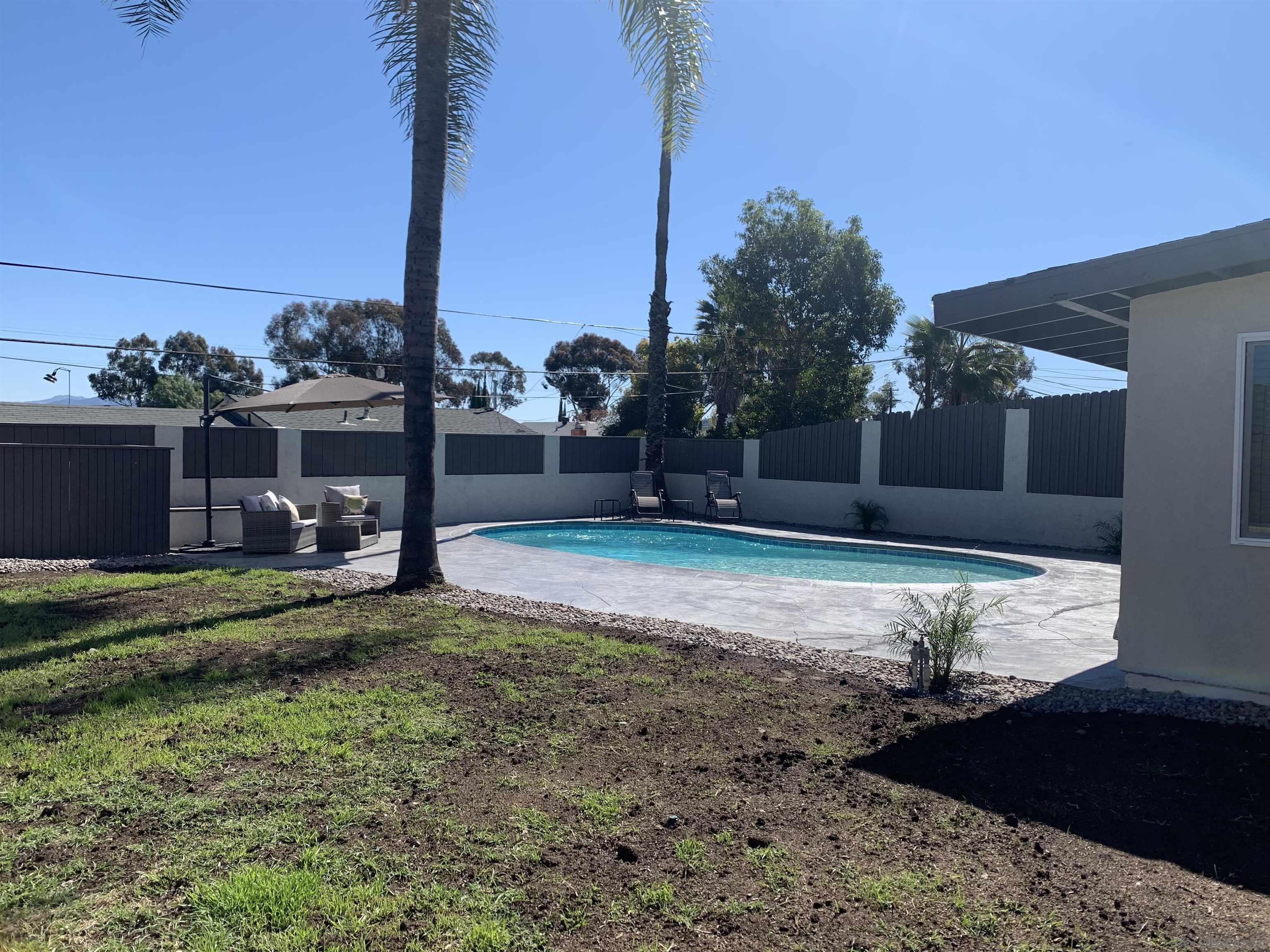 377 El Monte Road El Cajon, CA 92020 - Photo 11 of 19 a view of a backyard with a garden