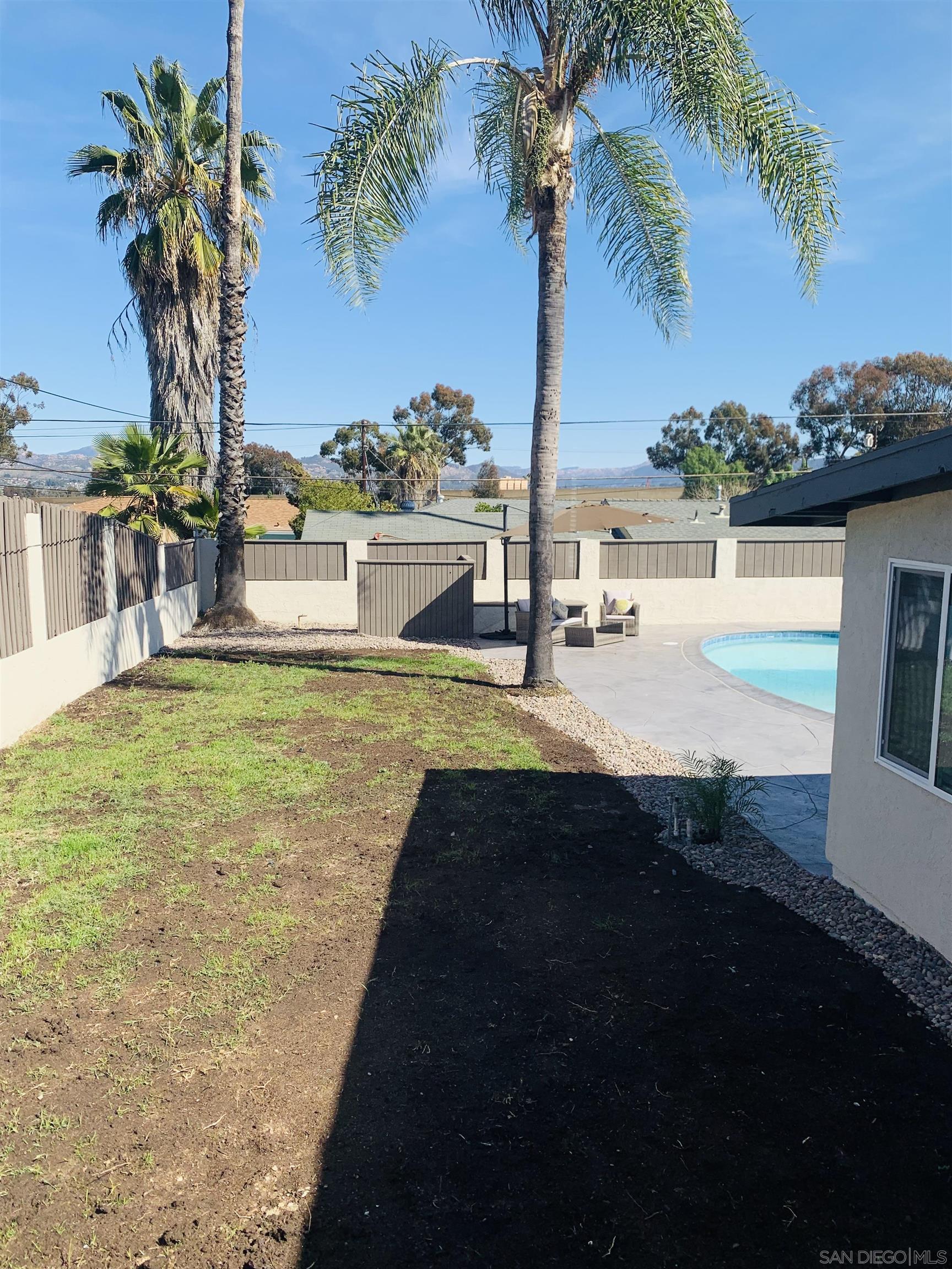377 El Monte Road El Cajon, CA 92020 - Photo 13 of 19 a view of a swimming pool and lounge chair