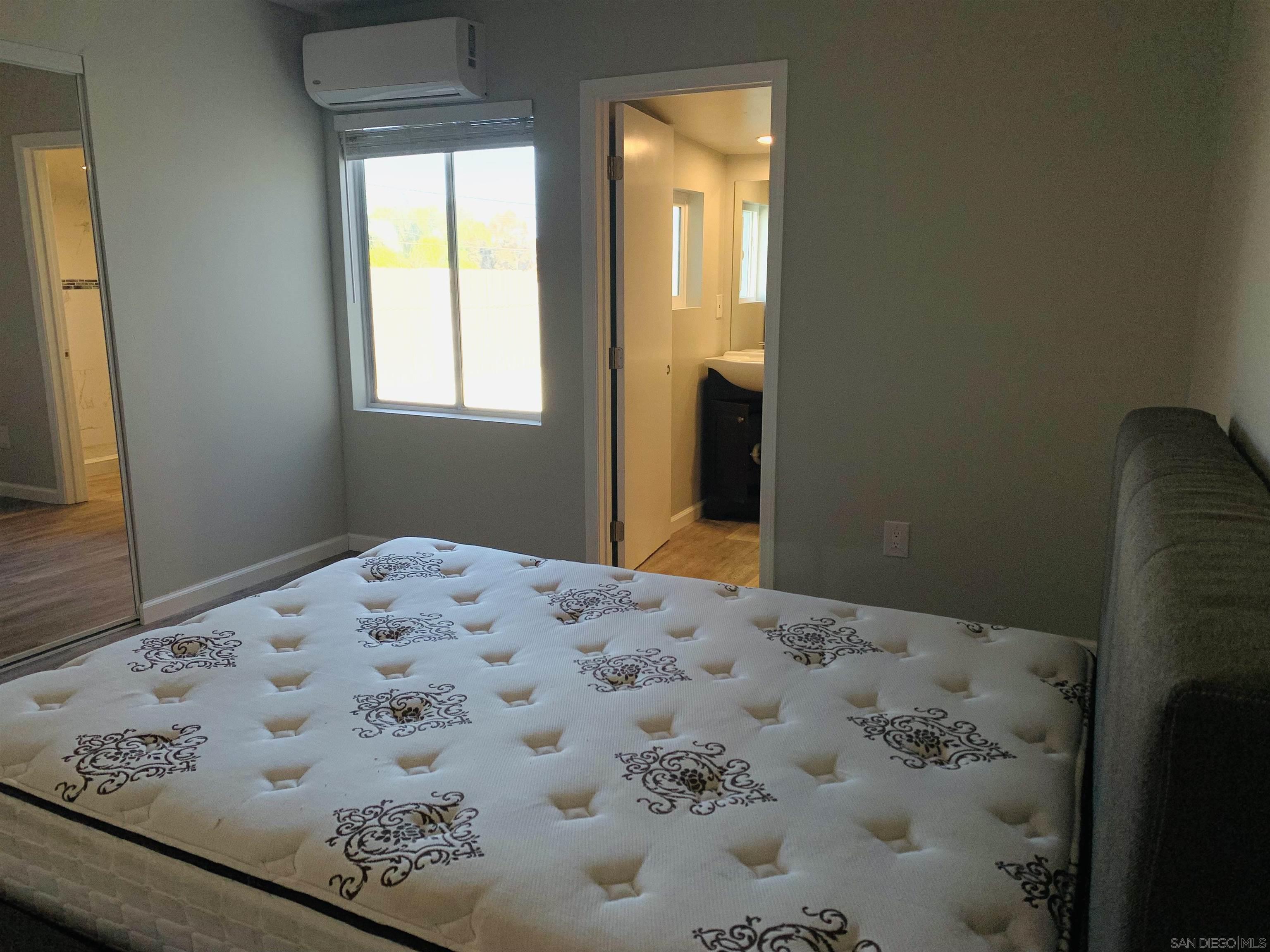 377 El Monte Road El Cajon, CA 92020 - Photo 14 of 19 a bedroom with a bed in it