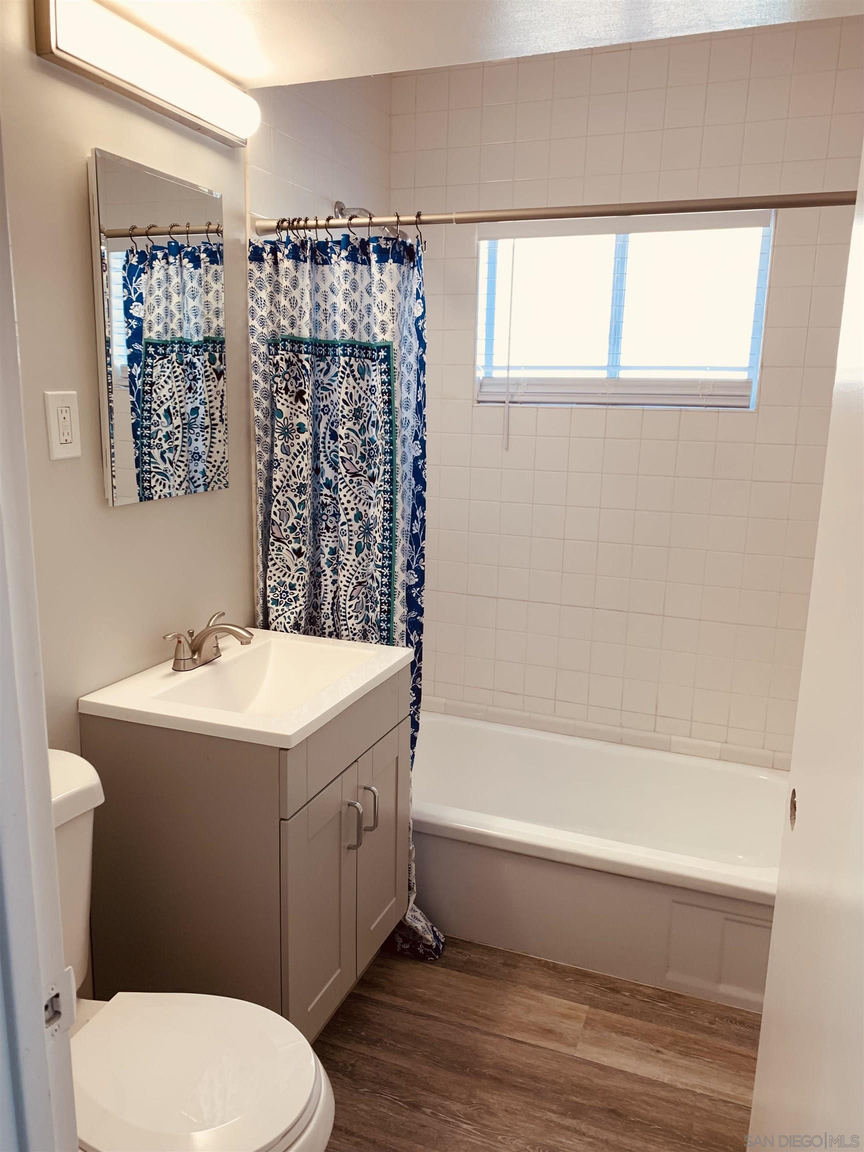 377 El Monte Road El Cajon, CA 92020 - Photo 17 of 19 a bathroom with a sink a toilet and a bathtub