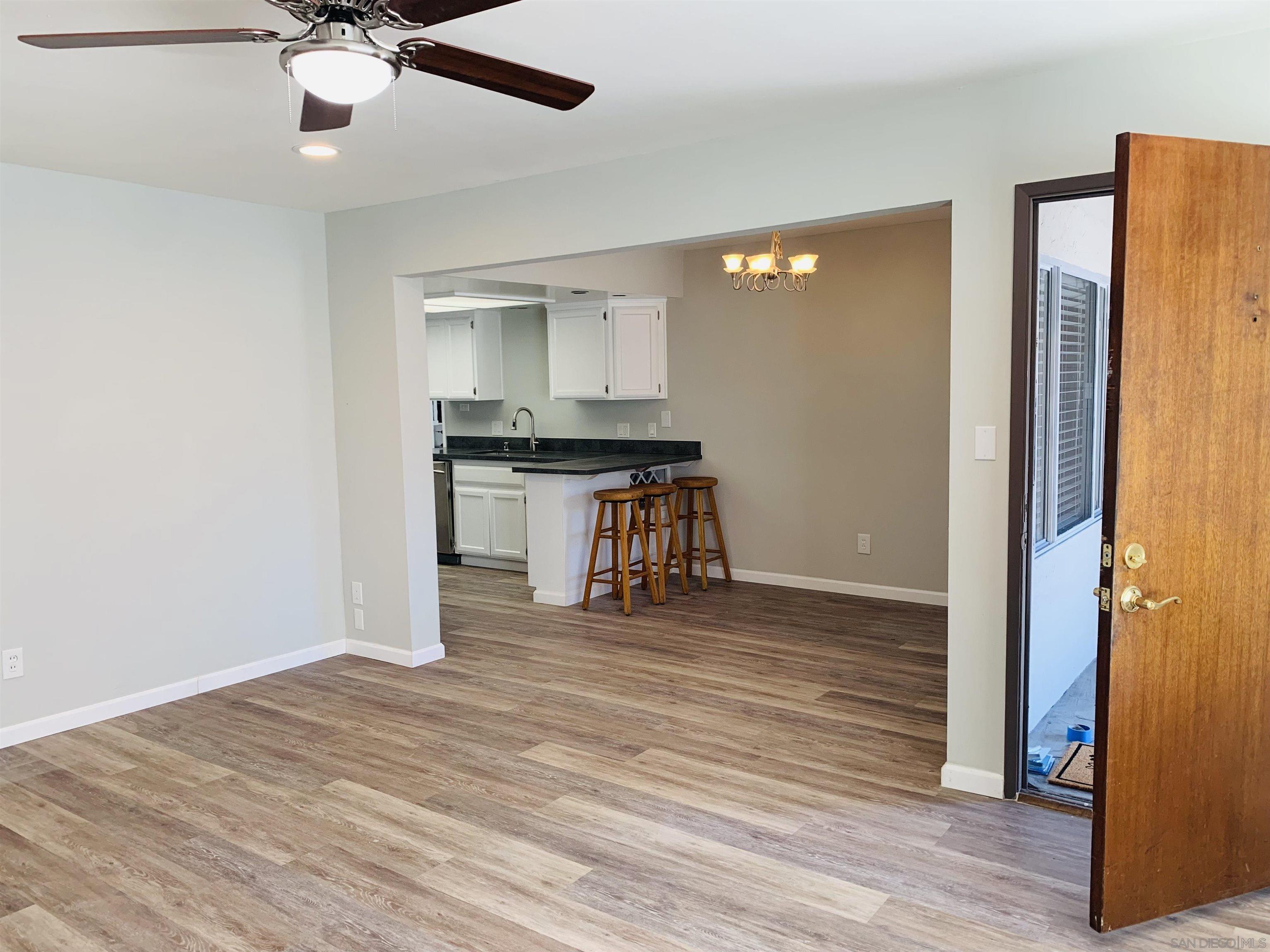 377 El Monte Road El Cajon, CA 92020 - Photo 9 of 19 a room view with wooden floor and ceiling fan