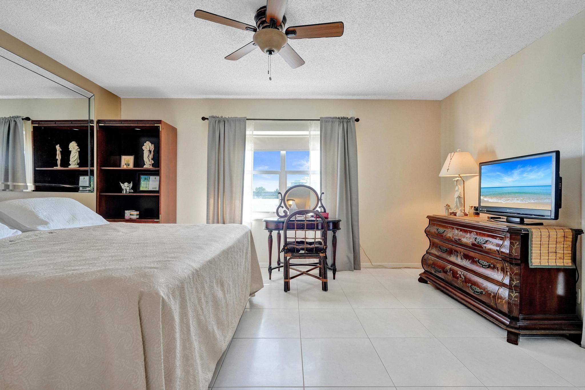 231 East Lantana Road, Unit 204 Lantana, FL 33462 - Photo 12 of 63 a living room with furniture and a flat screen tv