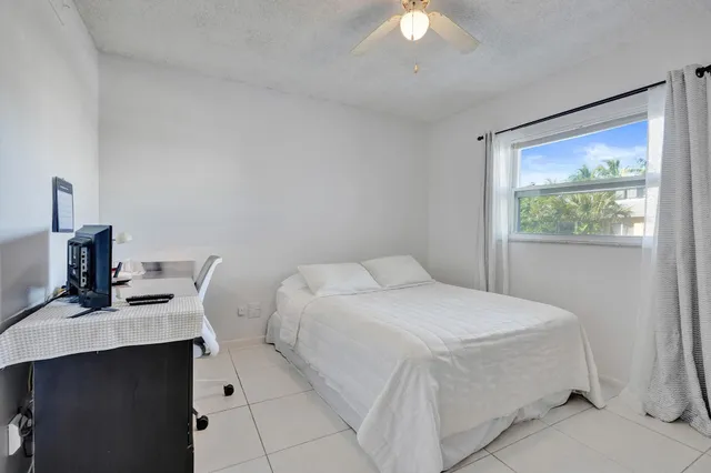 a bathroom with a toilet sink and shower