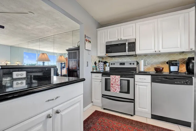 a dining room with furniture and chandelier