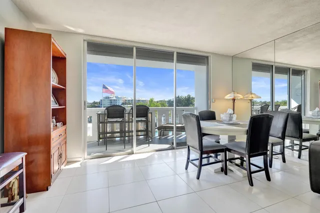 a view of a chairs and table in a balcony