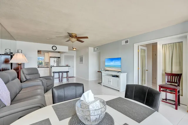 a view of outdoor dining space with a table and chairs