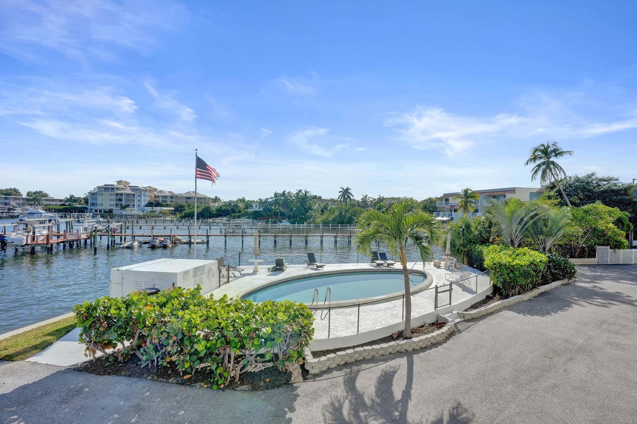 231 East Lantana Road, Unit 204 Lantana, FL 33462 - Photo 46 of 63 a view of a swimming pool with a patio