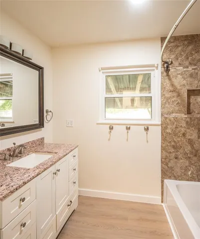 a view of a sink and a mirror