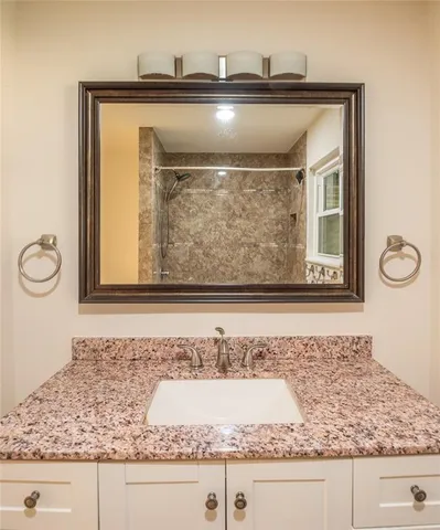 a bathroom with a bathtub and shower
