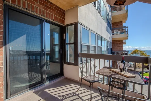 a view of a balcony with chairs