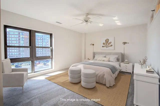 an empty room with windows and closet