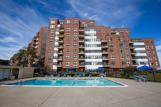 a view of a lake with a garden and trees