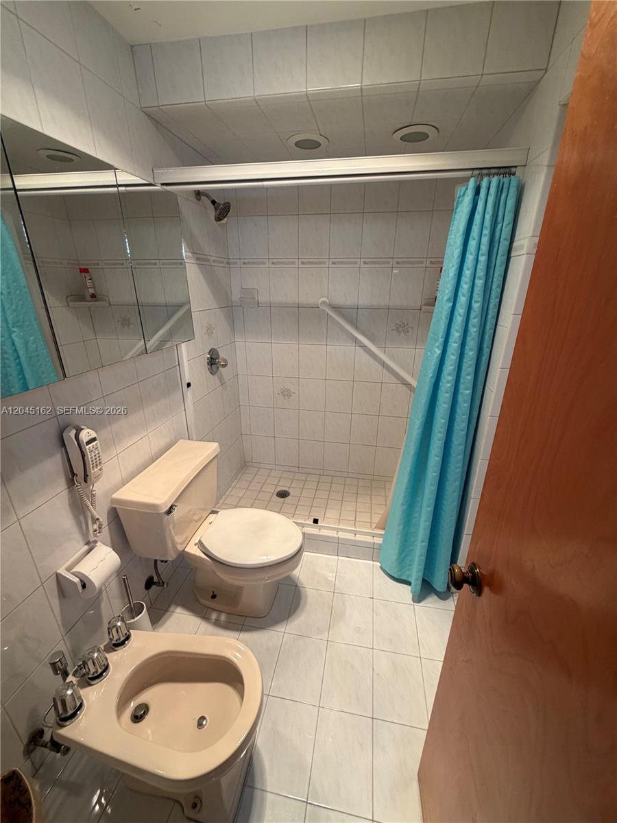 3262 Southwest 139th Place Miami, FL 33175 - Photo 21 of 36 a bathroom with a sink and a mirror