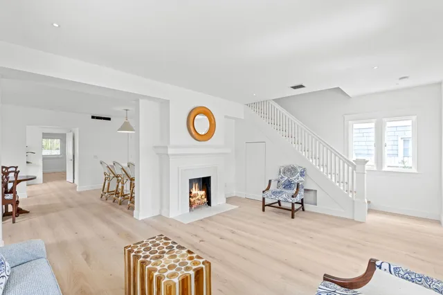 a living room with furniture a window and a fireplace