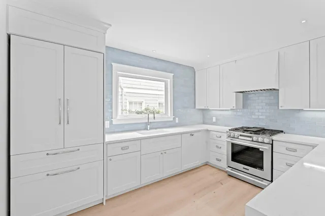 a view of a kitchen counter space and a window