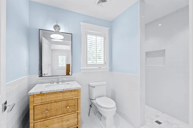 a view of room with wooden floor and cabinet