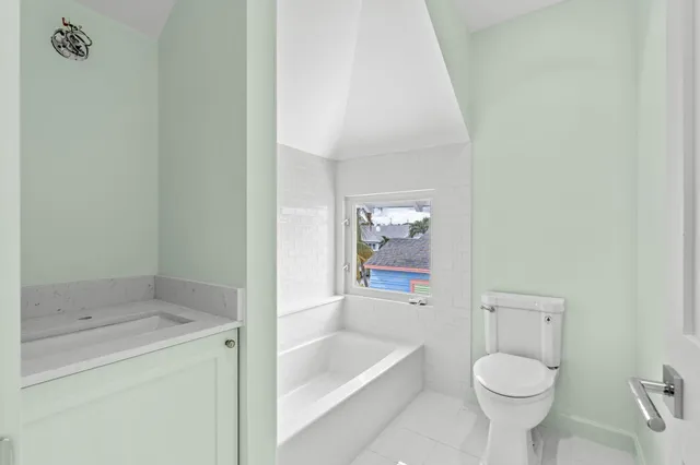 a bathroom with a sink toilet and bathtub