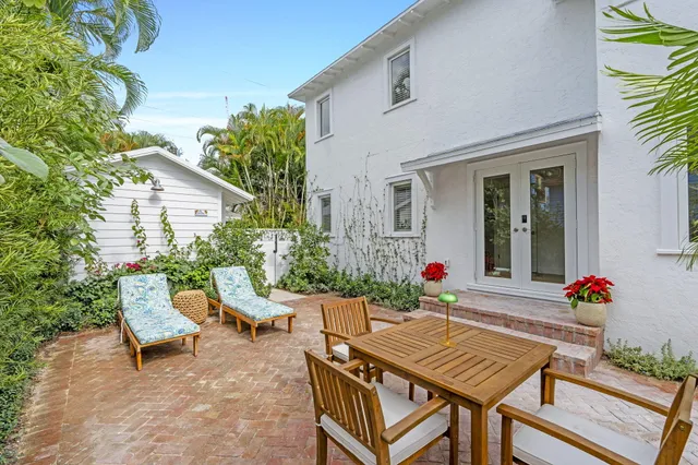 a outdoor space with a table and chairs