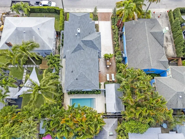 an aerial view of a house with a garden and yard