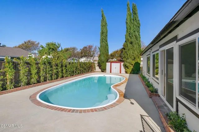 a view of a balcony with swimming pool