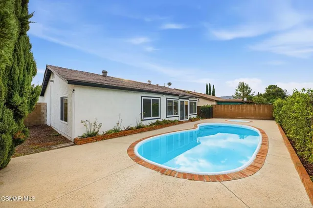 a view of a house with swimming pool