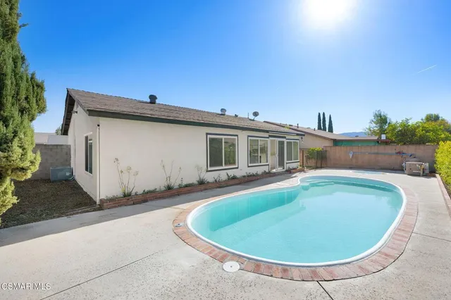 a view of a house with swimming pool