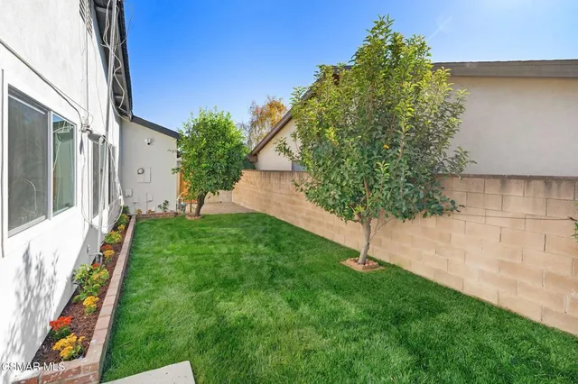 a backyard of a house with lots of green space