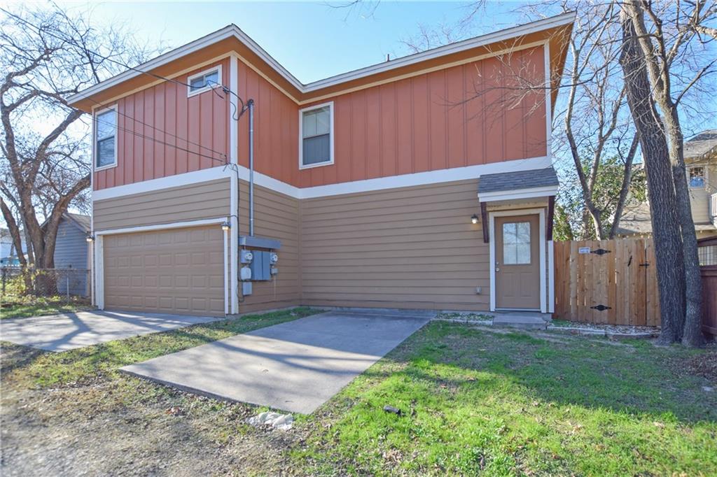 5405 Avenue H, Unit B Austin, TX 78751 - Photo 1 of 13 a front view of a house with a yard and garage