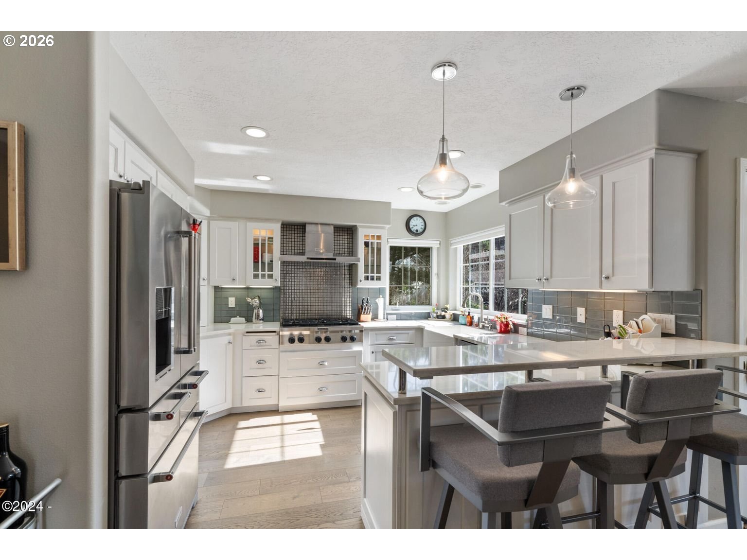 465 Edgewater Depoe Bay, OR 97341 - Photo 13 of 48 a kitchen with stainless steel appliances kitchen island granite countertop a sink and cabinets