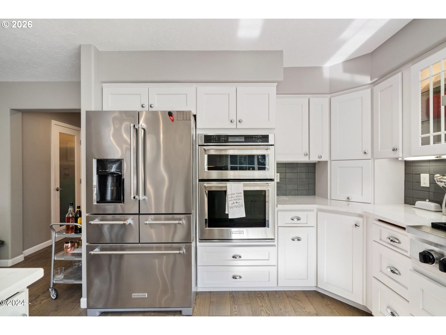 465 Edgewater Depoe Bay, OR 97341 - Photo 14 of 48 a kitchen with cabinets stainless steel appliances and wooden floor