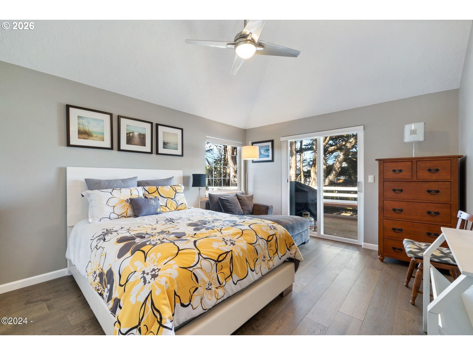 465 Edgewater Depoe Bay, OR 97341 - Photo 17 of 48 a bedroom with a bed a dresser and book shelfs