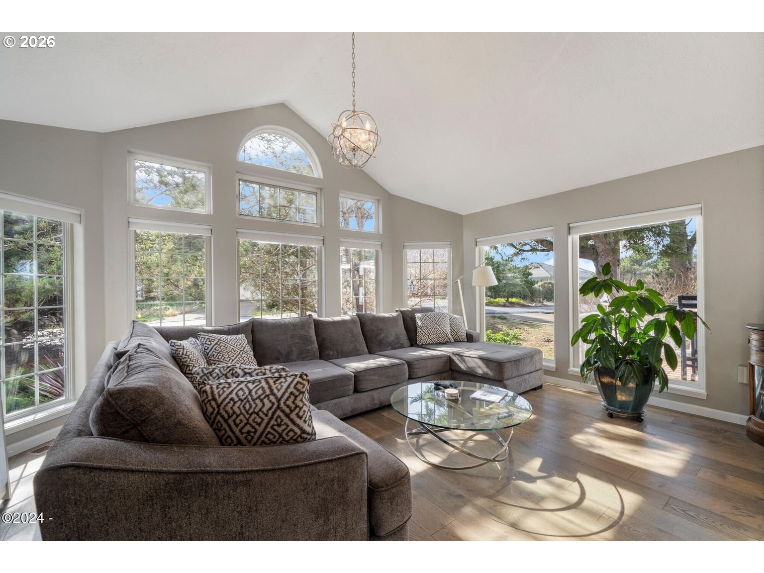465 Edgewater Depoe Bay, OR 97341 - Photo 5 of 48 a living room with furniture chandelier and a large window