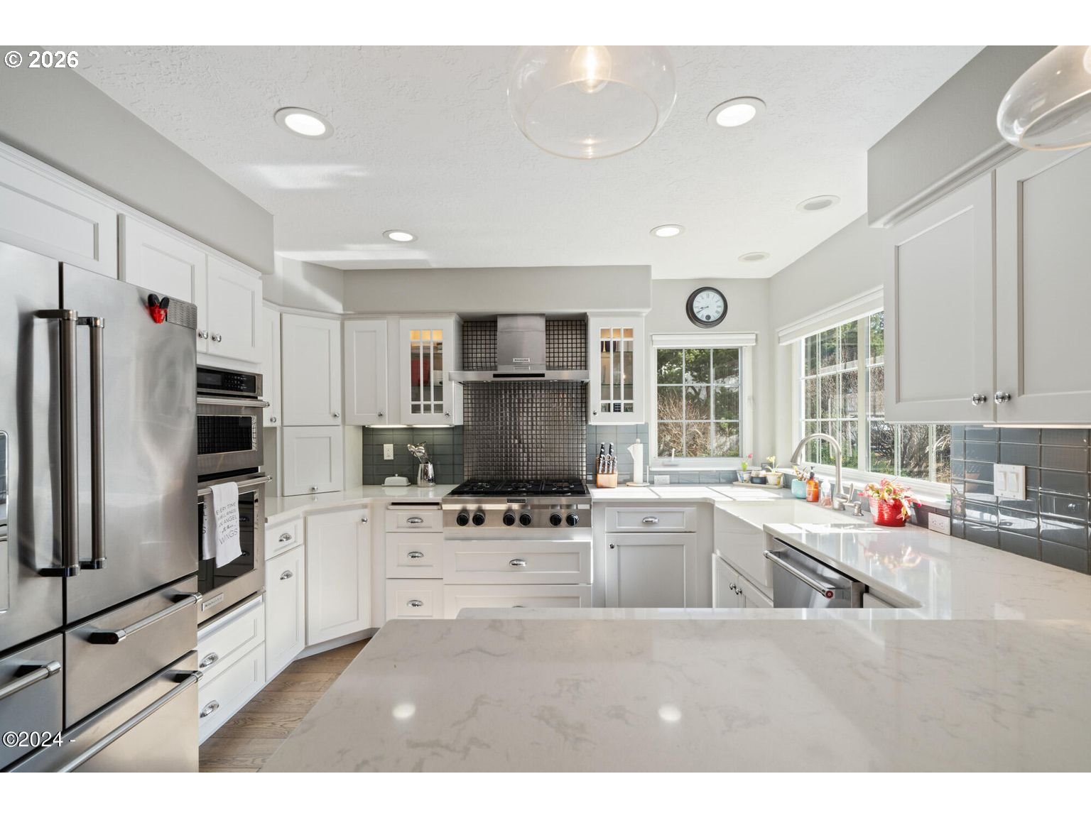 465 Edgewater Depoe Bay, OR 97341 - Photo 10 of 48 a kitchen with stainless steel appliances a refrigerator sink and microwave
