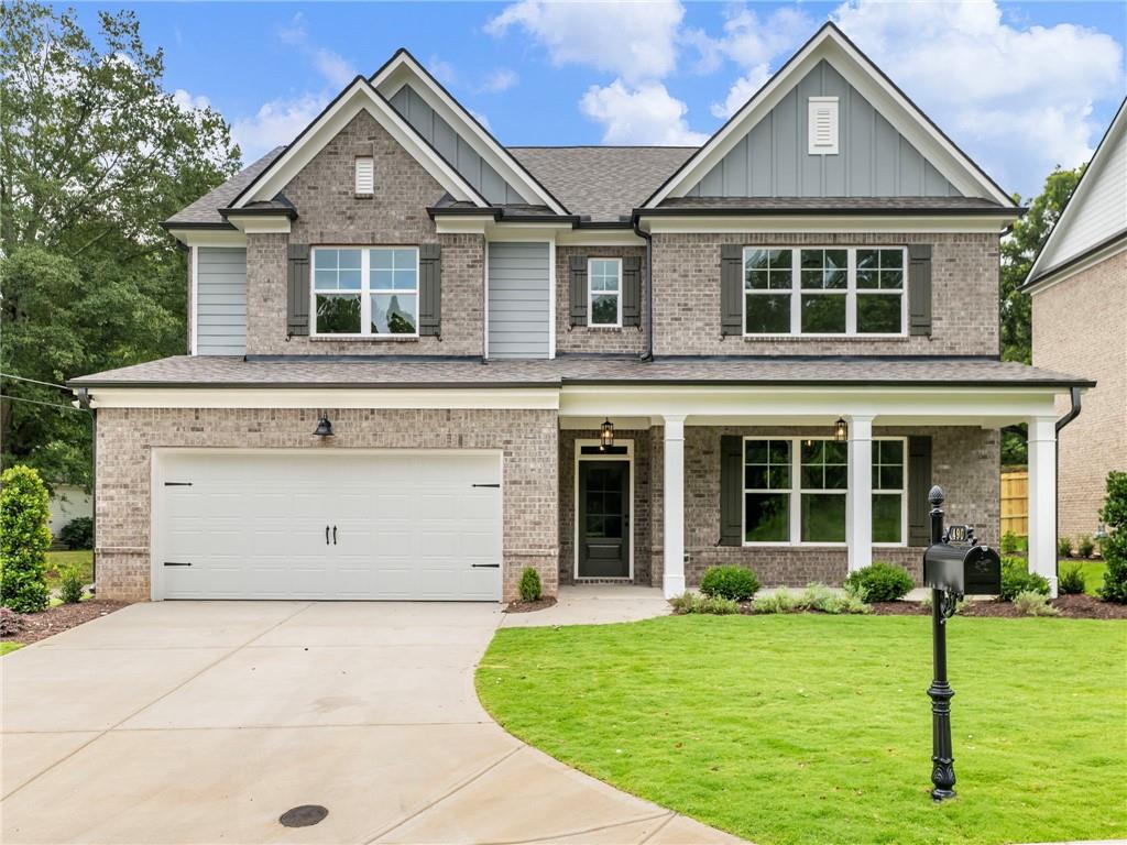 front view of a house with a yard