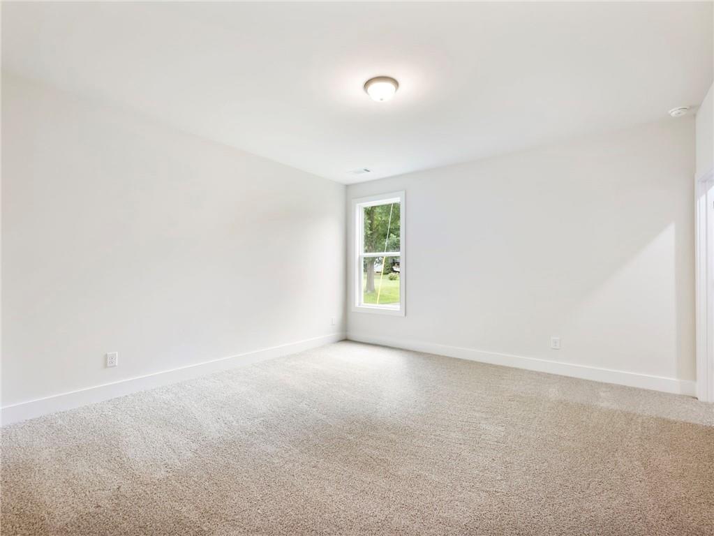 490 Jackson Street Buford, GA 30518 - Photo 16 of 46 an empty room with windows