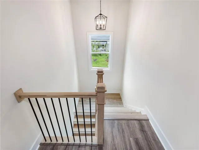 a view of a hallway with windows