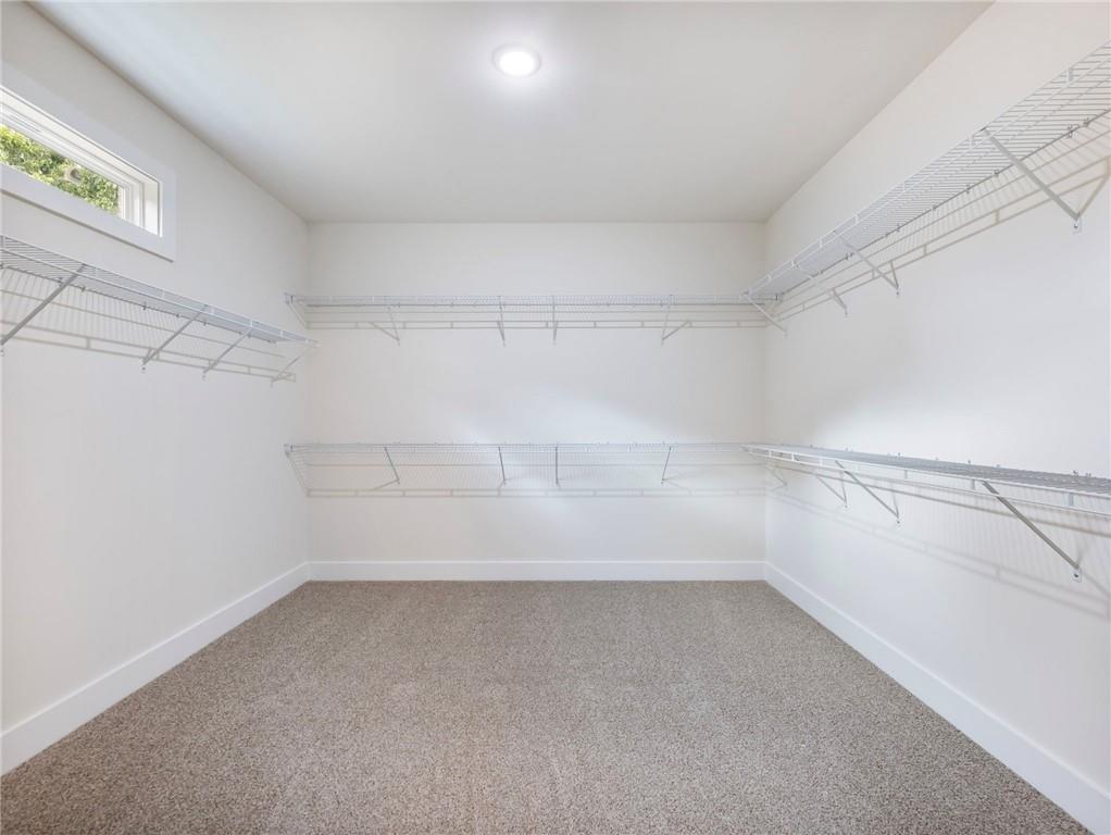 490 Jackson Street Buford, GA 30518 - Photo 31 of 46 a view of a room with racks on the wall