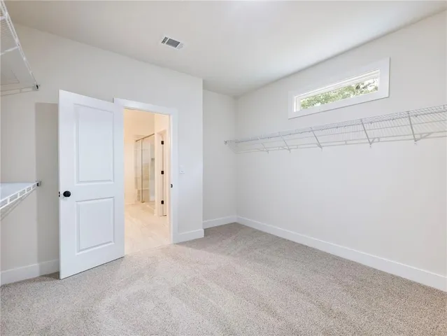 a view of an empty walk in closet