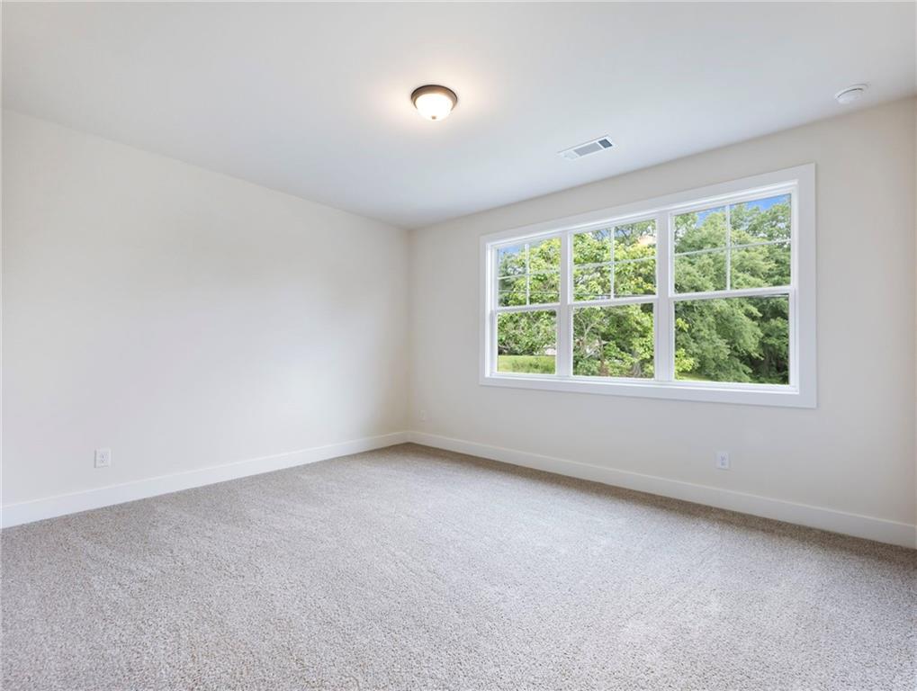 490 Jackson Street Buford, GA 30518 - Photo 37 of 46 an empty room with a window