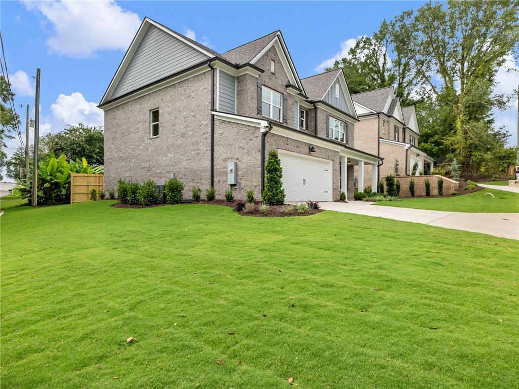 490 Jackson Street Buford, GA 30518 - Photo 46 of 46 a view of white house with a big yard and potted plants